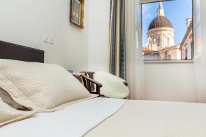 Postel nebo postele na pokoji v ubytování Apartments Placa Dubrovnik