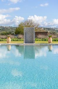The swimming pool at or close to CARLOS MANSION LUXURY SUITES