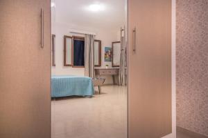 Postel nebo postele na pokoji v ubytování Armonia Seaside Villas