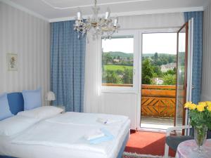 Postel nebo postele na pokoji v ubytování Hotel Rosner