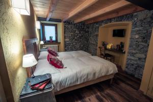 Rúm í herbergi á Rifugio Lilla