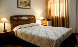 Hotel Chucarima 객실 침대