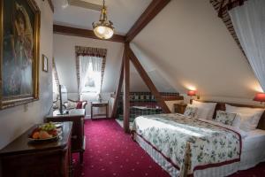 Postel nebo postele na pokoji v ubytování Hotel Belle Epoque