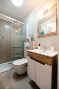 a bathroom with a toilet and a sink and a shower at Kailani Luxury Central 3 Bedroom, 3 Bathroom Apartment With a Sunny Balcony in Zadar