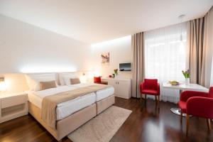 Postel nebo postele na pokoji v ubytování Hotel Vila Viola