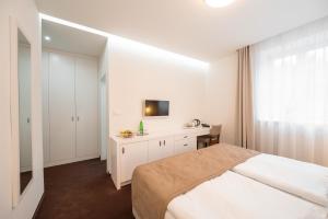 Postel nebo postele na pokoji v ubytování Hotel Vila Viola