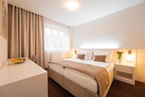 Postel nebo postele na pokoji v ubytování Hotel Vila Viola