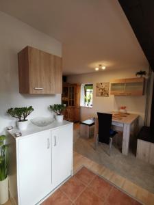 a kitchen with a table and a dining room at Lenzenhof anno 1720 I in Schotten