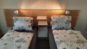 Postel nebo postele na pokoji v ubytování Guesthouse Petit Pré