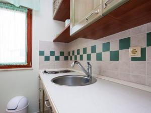 a kitchen counter with a sink and a window at Apartment Toni 555 in Primošten +87 photos
