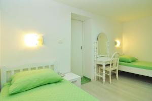 Postel nebo postele na pokoji v ubytování Apartments Tojčić