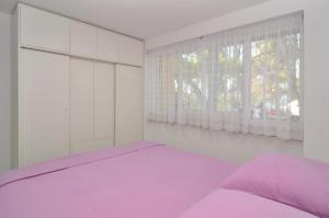 Postel nebo postele na pokoji v ubytování Apartments Tojčić