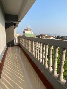 a balcony with a view of the city at The Treat Hotel in Madgaon