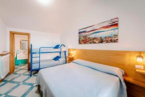 Postel nebo postele na pokoji v ubytování A casa di Nonna Marianna