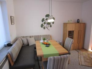 a living room with a couch and a table at Ferienwohnung Luzia in Nettetal