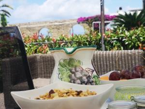 a table with two bowls of food on it at B&b Villa Rosalia in Procida