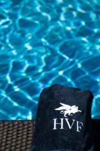 a towel sitting next to a swimming pool at Hotel Villa Franca in Positano