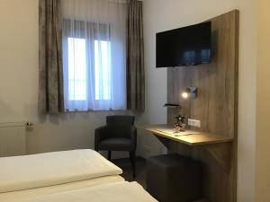 Postel nebo postele na pokoji v ubytování Gasthof Hotel Esterer