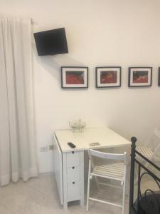 TV a/nebo společenská místnost v ubytování Home La Corte