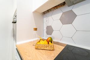 A kitchen or kitchenette at EdSam Madrid Apartments White