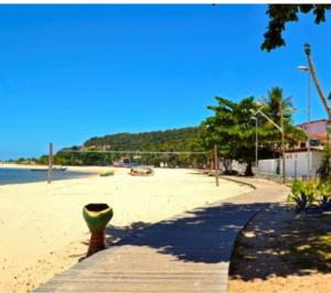 a sandy beach with a volleyball net on the beach at Casa em Gamboa in Gamboa