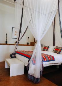 Кровать или кровати в номере Madi a Thavha Mountain Lodge