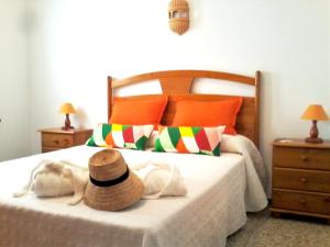 a bedroom with a bed with a dog laying on it at 3 bedrooms house at El Golfo Lanzarote 500 m away from the beach with furnished terrace and wifi in El Golfo