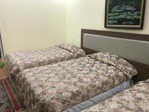 Voodi või voodid majutusasutuse Ngoc Tran Hotel toas