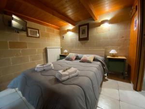 Łóżko lub łóżka w pokoju w obiekcie Fattoria Il Noce B&B