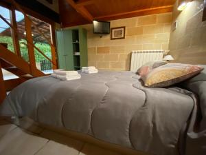 Łóżko lub łóżka w pokoju w obiekcie Fattoria Il Noce B&B
