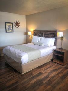 Postel nebo postele na pokoji v ubytování Best Inn Texas