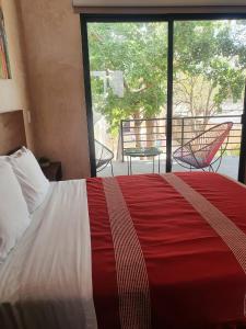 Postel nebo postele na pokoji v ubytování Hotelito YUM KAAX
