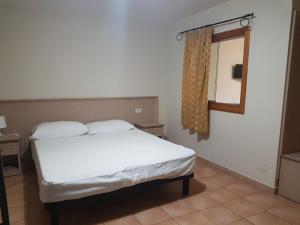 A bed or beds in a room at Green Park Residence