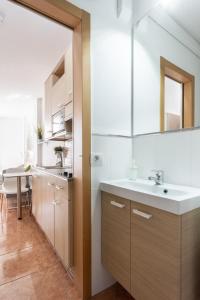 a bathroom with a sink and a mirror at Apartamentos Ohana - Edificio Tonillo in Los Cristianos