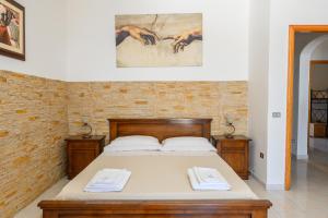 מיטה או מיטות בחדר ב-Complesso Delle Antiche Rotte