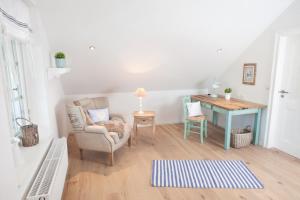 Ein Sitzbereich in der Unterkunft Belle Maison - Das kleine Hotel