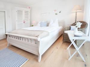 Ein Bett oder Betten in einem Zimmer der Unterkunft Belle Maison - Das kleine Hotel