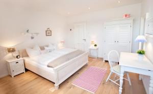 Ein Bett oder Betten in einem Zimmer der Unterkunft Belle Maison - Das kleine Hotel