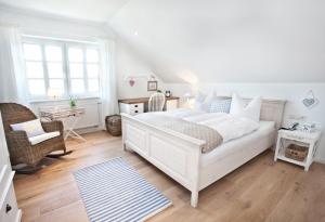 Ein Bett oder Betten in einem Zimmer der Unterkunft Belle Maison - Das kleine Hotel