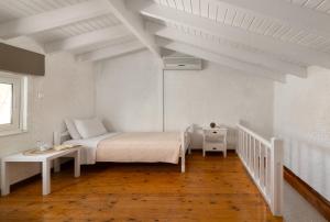 Posteľ alebo postele v izbe v ubytovaní Elefteria Apts & Suites