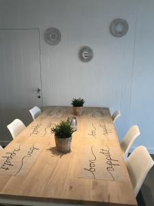 a wooden table with some writing on it at Villa Capricia in Nieuwpoort