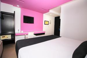 Posteľ alebo postele v izbe v ubytovaní Nu Hotel