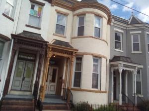 a large house with a front door and a porch at Orange Wildflowers in Richmond