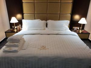 Postelja oz. postelje v sobi nastanitve Rich-Bridge Hotel