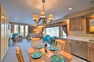 a kitchen and dining room with a table and chairs at Big Sky Ski-InandSki-Out Condo with Mountain Views! in Big Sky