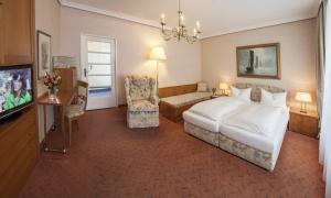 Postel nebo postele na pokoji v ubytování Strandhotel Monbijou GmbH garni