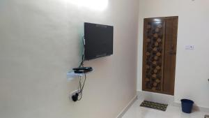 TV a/nebo společenská místnost v ubytování Green Apple Resorts