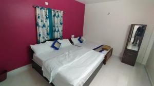 Postel nebo postele na pokoji v ubytování Green Apple Resorts