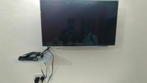 TV a/nebo společenská místnost v ubytování Green Apple Resorts