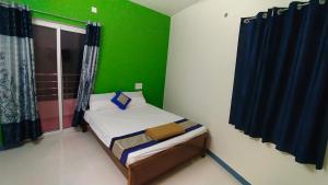 Postel nebo postele na pokoji v ubytování Green Apple Resorts